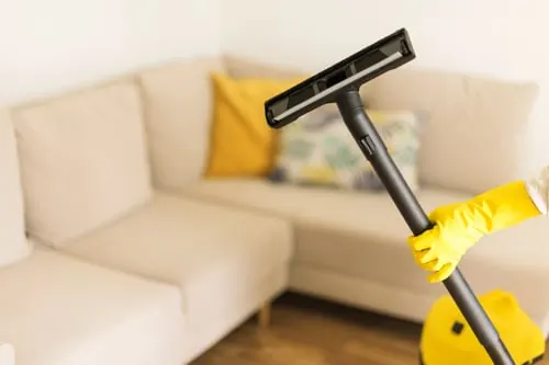 Cleaner detailing a kitchen counter in an East Bay home